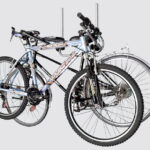 Fahrrad und Fahrradträger platzsparend lagern – per Wandhalter und Dachboxlift 